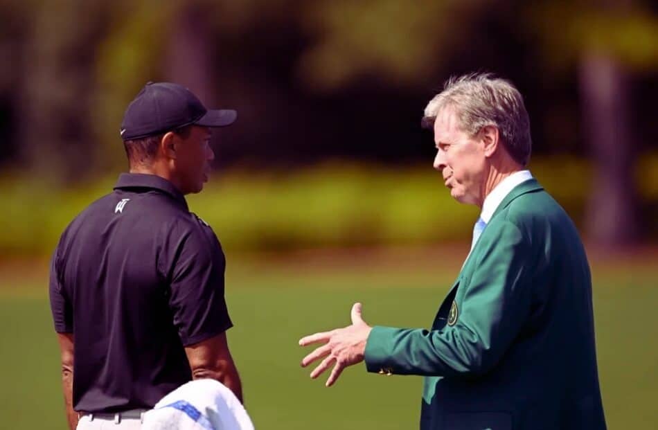 Tiger Woods speaks with Fred Ridley
